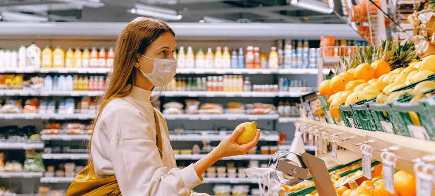 woman wearing a mask in a grocery store